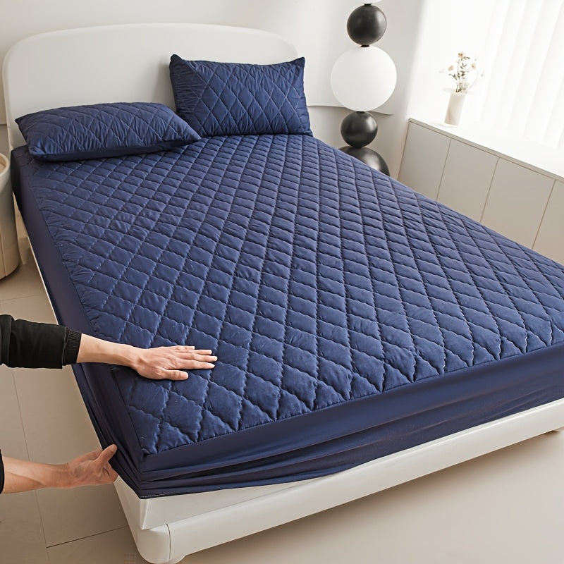 Diamond quilted waterproof bed sheet protector made of 100% woven polyester. Machine washable and available in multiple sizes (pillow shams not included).