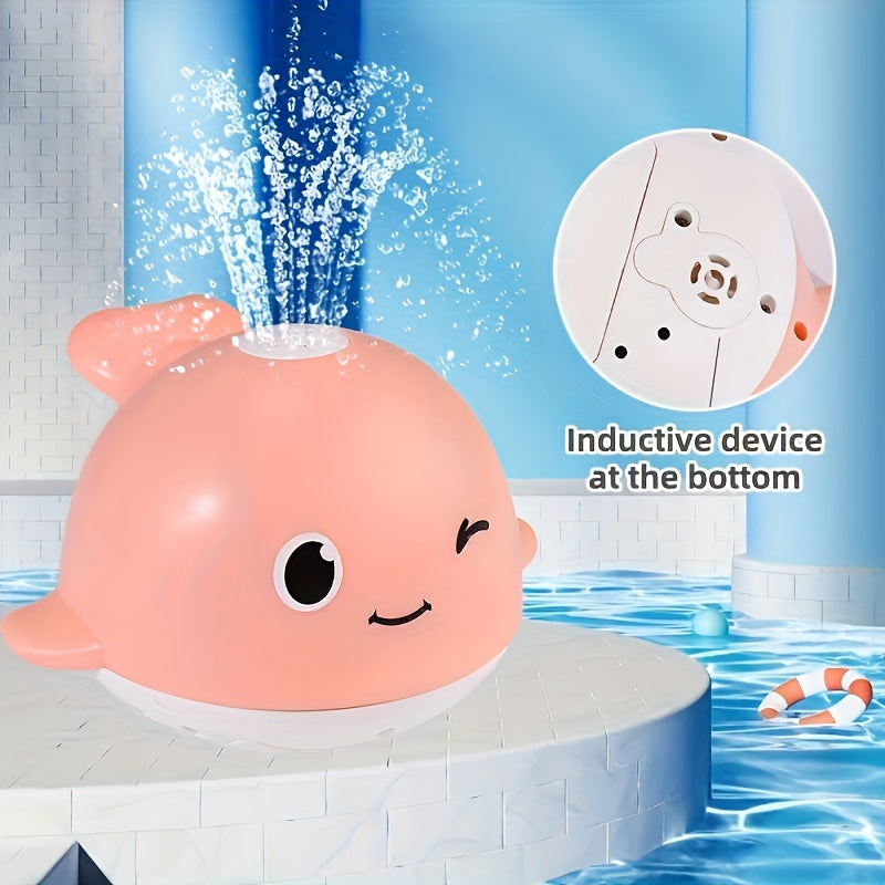 Electric light sensing water spraying whale toy, a fun novelty toy for children's bath time and holiday gifting. Batteries not included.