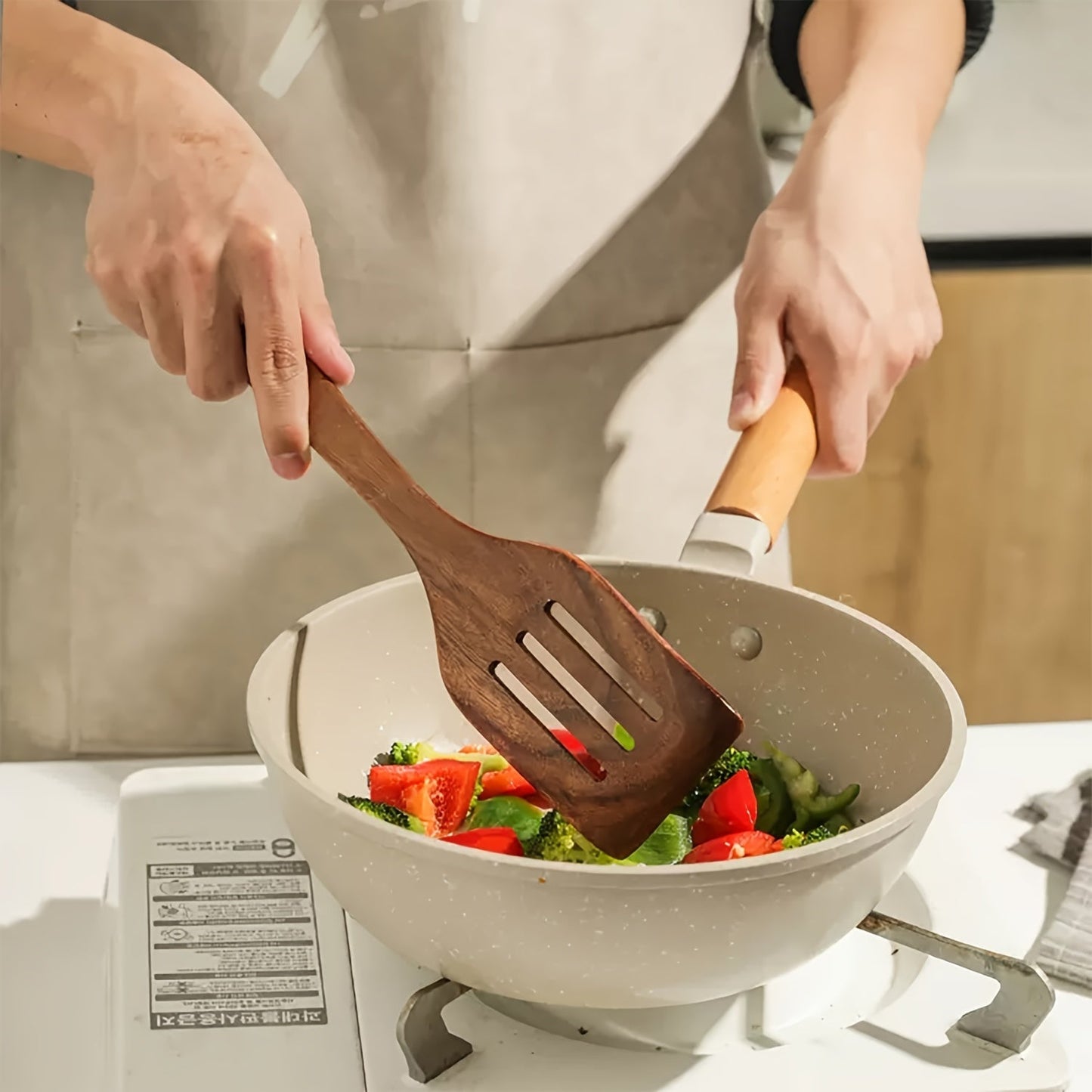 Six wooden utensils set, including cooking spoons, that are both sturdy and elegant kitchen tools for both preparation and serving purposes.