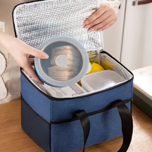 Insulated lunch bag with aluminum lining, made with double-layered Oxford fabric for a large capacity. Features front and side pockets, perfect for office, picnic, camping, or travel. Convenient and portable food storage option that is machine washable.