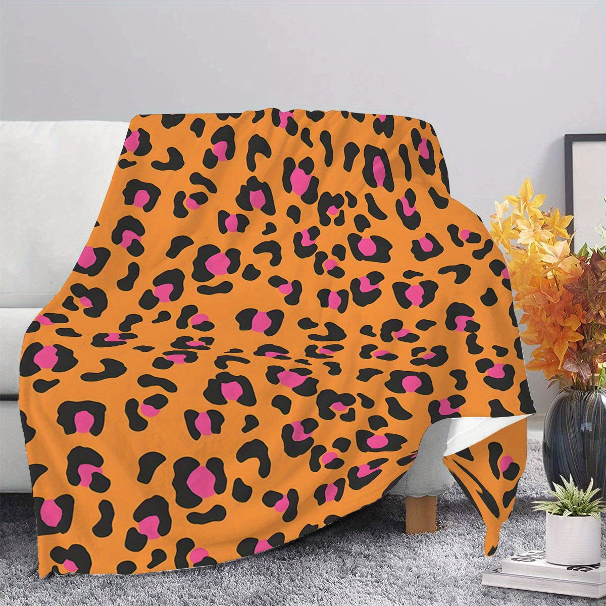 Soft and cozy flannel fleece blanket with a contemporary design. Suitable for all seasons, this blanket is machine washable and features a digital print orange leopard pattern. Made with a polyester cover, this warm plush blanket weighs 200-250gsm and is