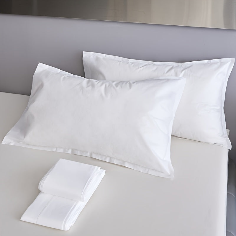 Two pieces of sterile disposable travel pillow covers with sealed envelopes. They are partially cleaned, pure white, and made of thick breathable non-woven polyester. Ideal for travel, hotels, and salons. The covers are unprinted and come in a pair. Use