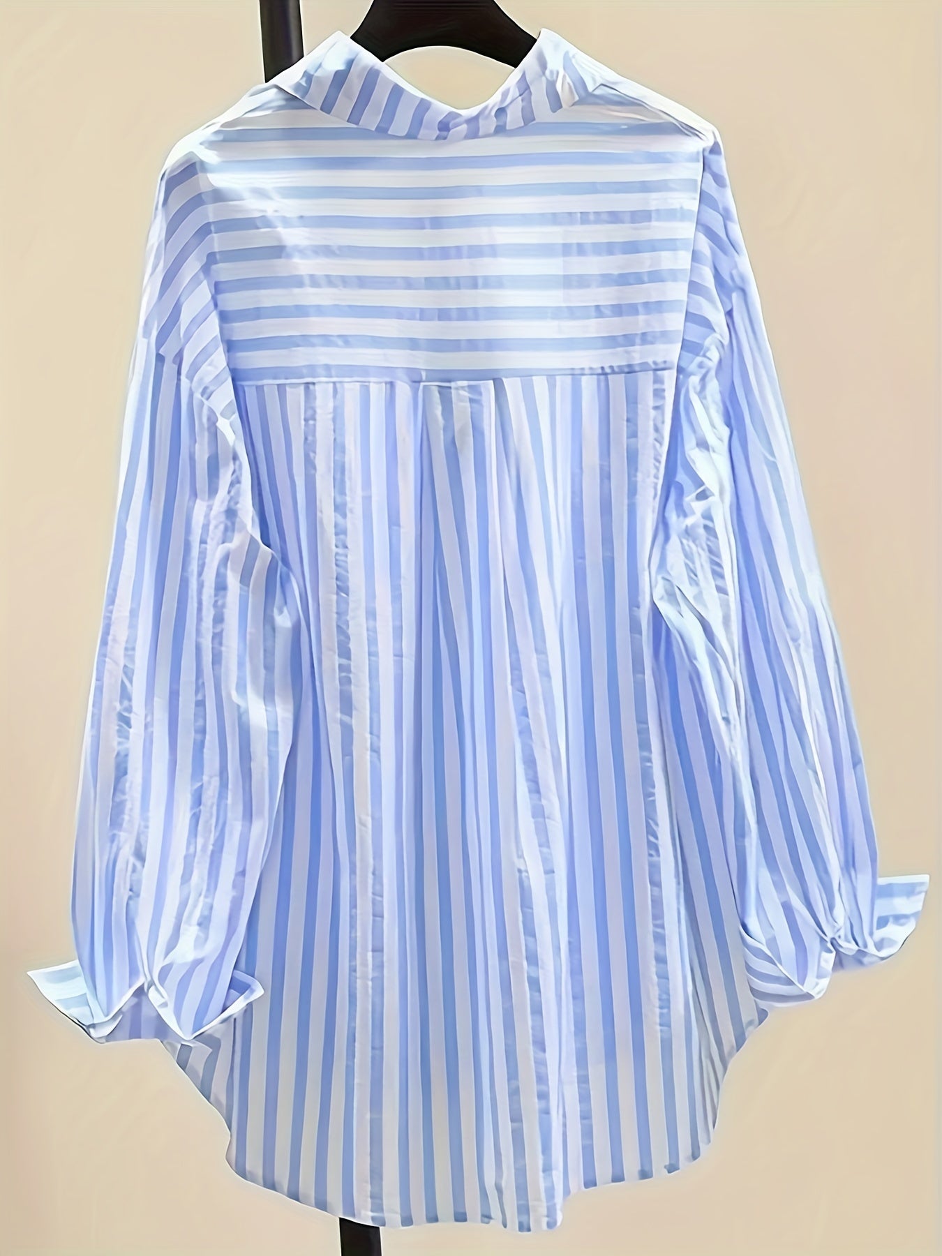 Women's blue and white striped long sleeve button-up shirt with collar, chest pocket. Made of lightweight polyester, machine washable. Suitable for all-season casual or dressy wear.