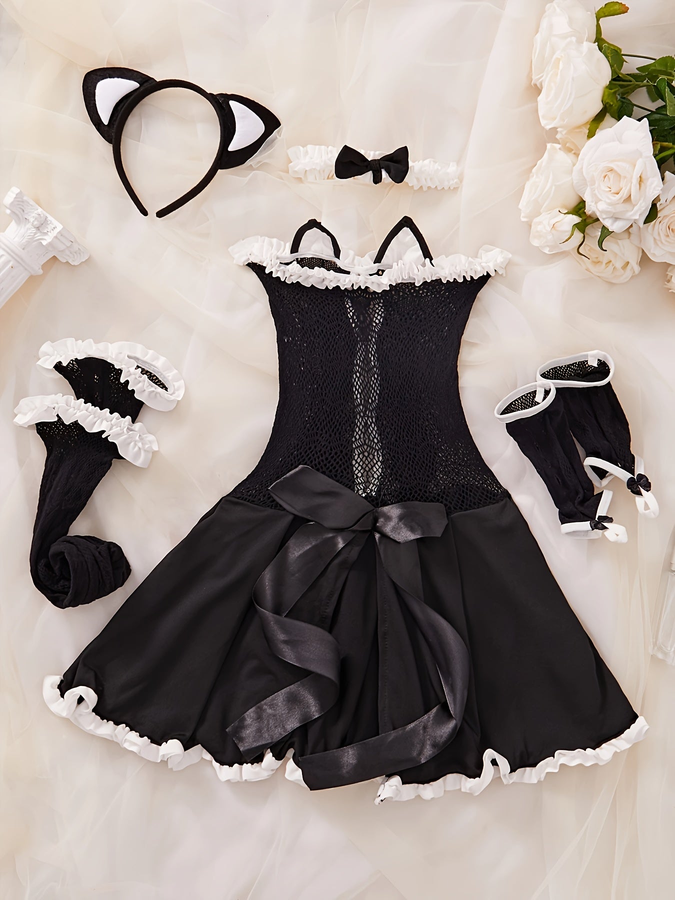 Sexy lingerie set includes headband, bow tie, clothing, gloves, and fishnet stockings.