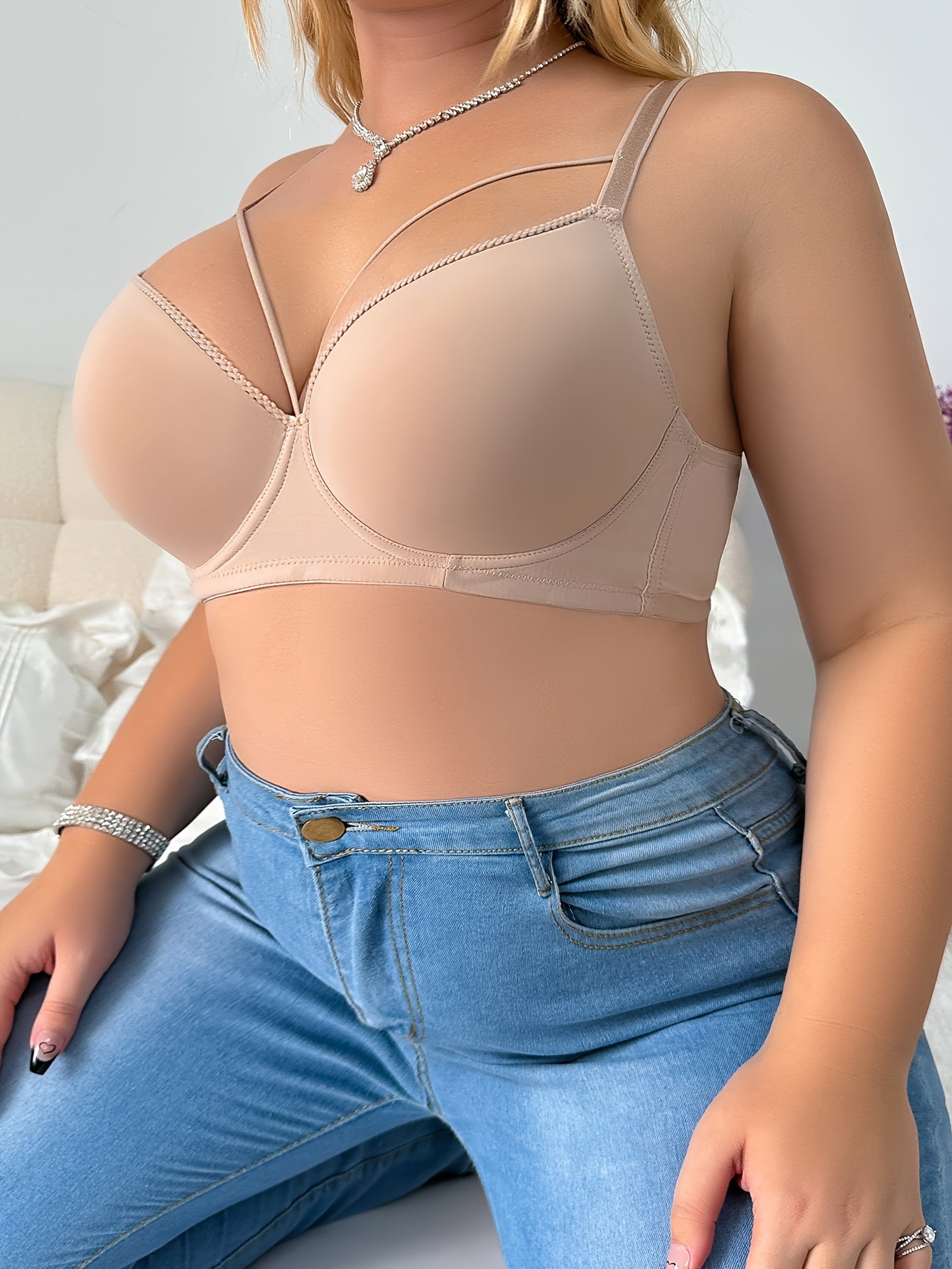 Elegant beige bra for plus size women with push-up design, underwire support, and breathable nylon blend. Hand washable and non-removable pads for comfort and sleek full coverage lingerie.