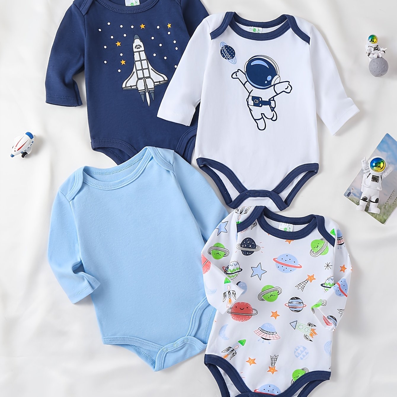 Boys' 4-pack long sleeve cotton onesies with astronaut and space patterns, perfect for fall/winter. Made with knit fabric for a regular fit and slight stretch. Suitable for outdoor wear for