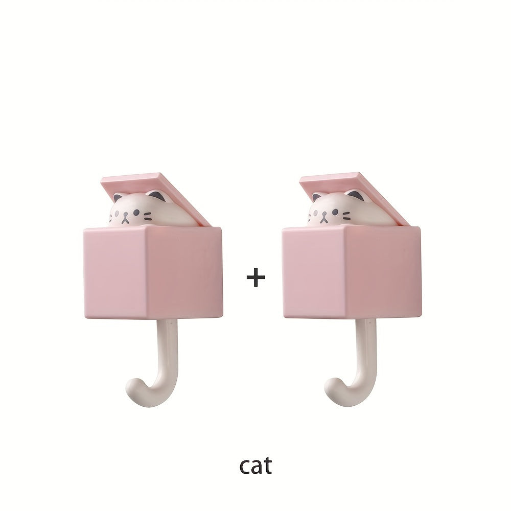 Punch-free retractable cat wall hook set for kitchen, bathroom, and office use. Strong and non-marking sticky hooks for hanging keys, coats, and more.