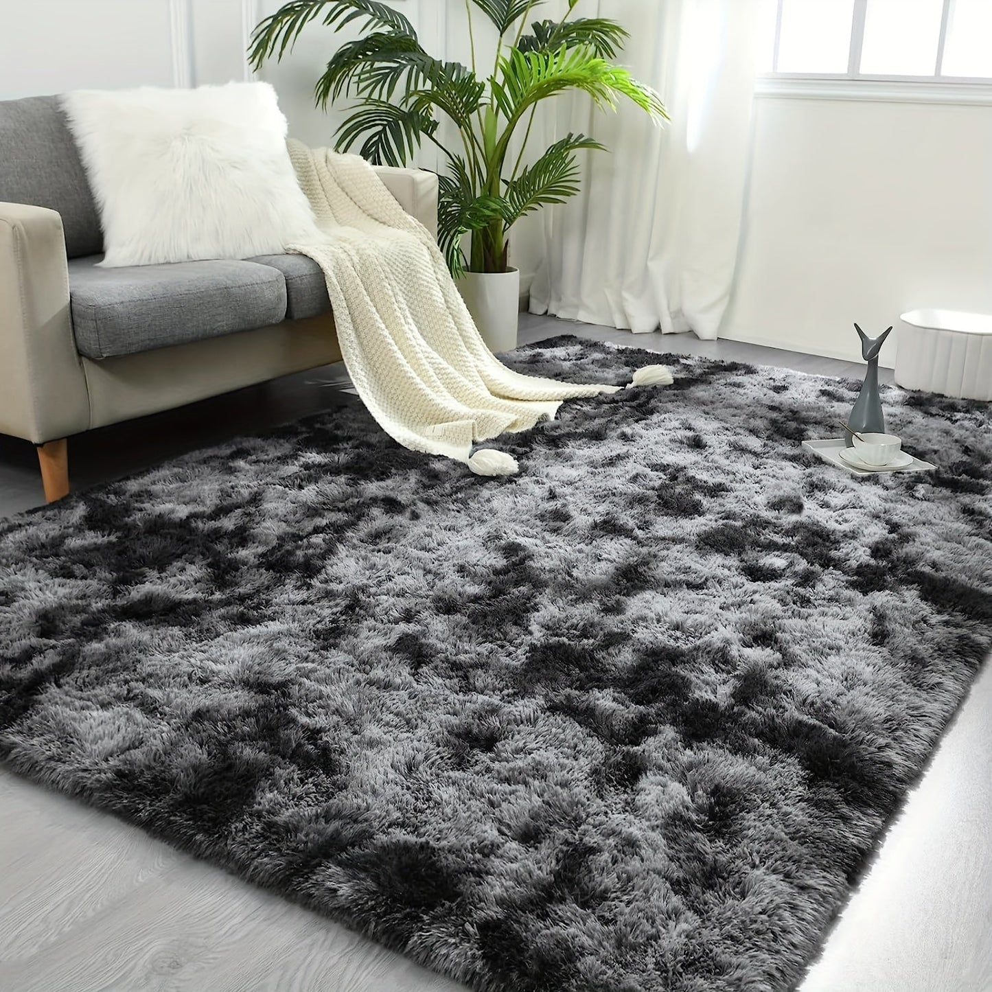 Luxurious Soft Faux Fur Area Rug in Modern Deep Grey Shaggy Design, Perfect for Living Room or Bedroom Decor. Made of Ultra Soft Polyester Material, Dry Clean Only. Available in Various Sizes.