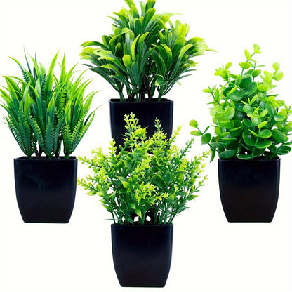 Set of 4 small faux eucalyptus plants in black pots for indoor decoration.