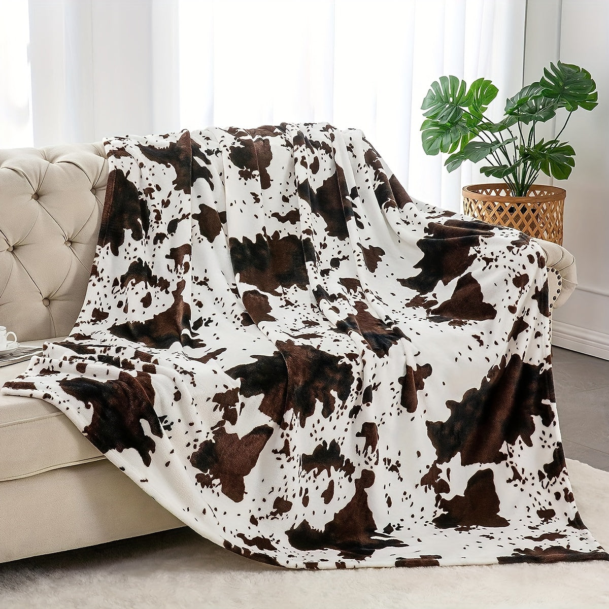 Get cozy with this soft and warm cow print blanket. Perfect for adding a touch of whimsy to your sofa, couch, or bed, this lightweight throw is made from plush flannel fleece. It's a great gift idea for any cow lover and perfect for all seasons.