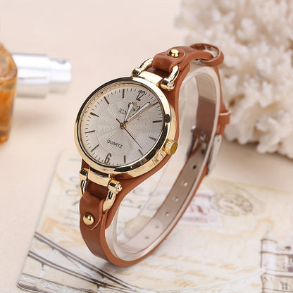 1 elegant women's quartz watch with black faux leather strap and golden-tone accents - fashionable analog display, battery operated, perfect for everyday and special occasions.