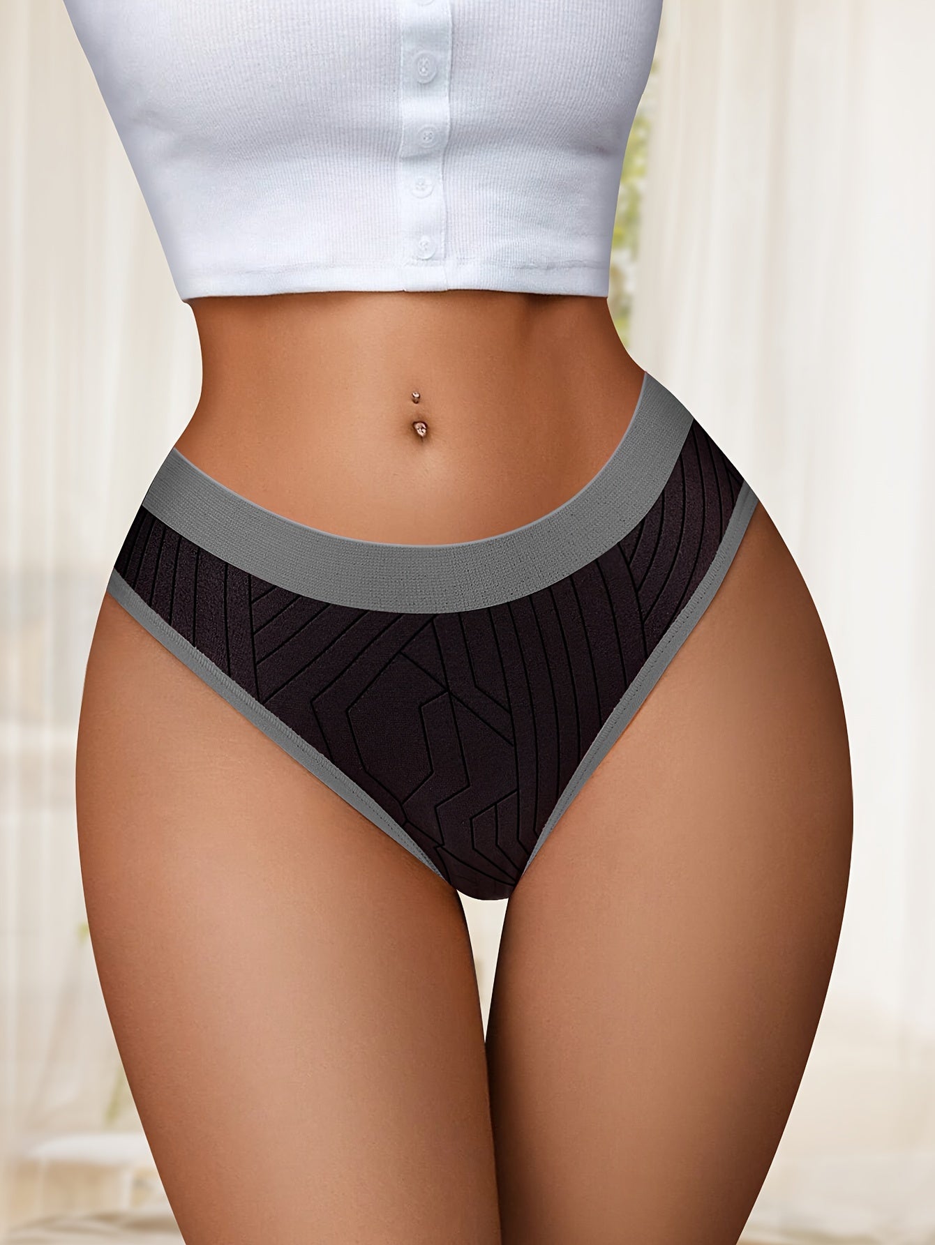 10 low-rise women's briefs: soft, stretchy nylon blend with colorblock design.