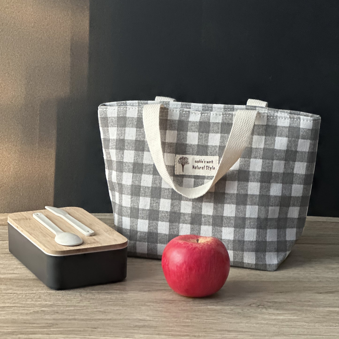 Stay organized and stylish with our plaid insulated lunch bag, made from durable materials to keep your items safe and secure. Available in classic color combinations of black and white, blue and white, and green and white, this lunch bag is versatile