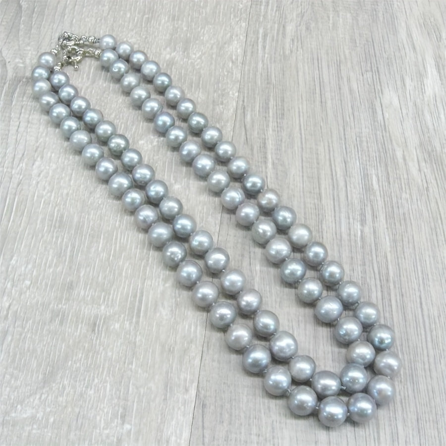 This MYSOYA natural freshwater pearl necklace is handmade with care and features 100% silvery gray pearls. The vintage elegant style and 10-12mm pearls make it a versatile piece of unisex jewelry. It comes in a beautiful gift box, making it the perfect