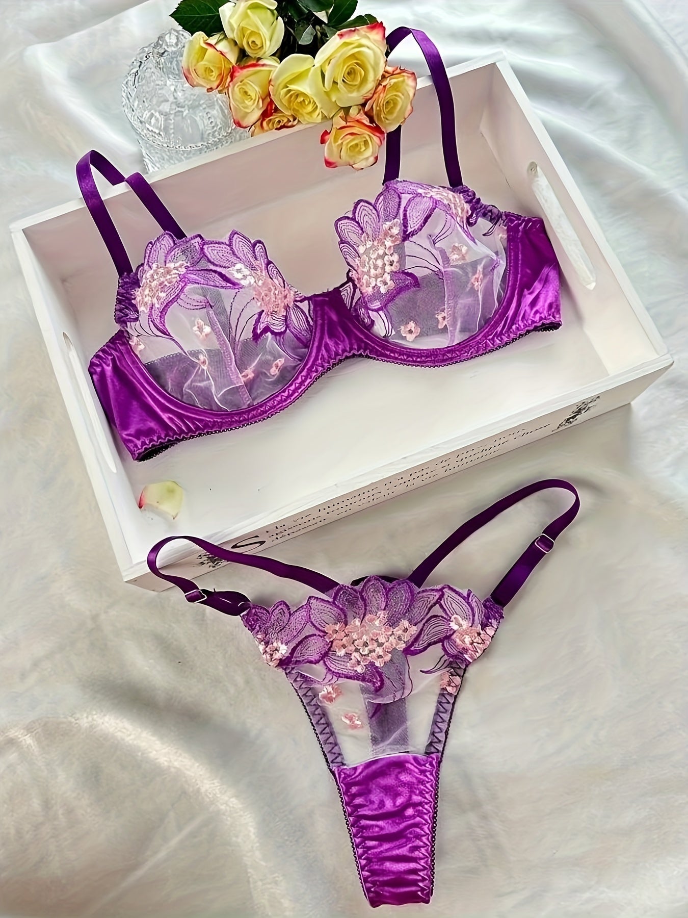 Floral embroidered sheer lingerie set with low cup non-padded bra and G-strings for women.