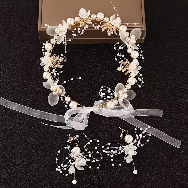 Vintage-style faux pearl flower tiara for brides, fairy princesses, and boho brides. Add a touch of elegance to your wedding hair with this beautiful headband.