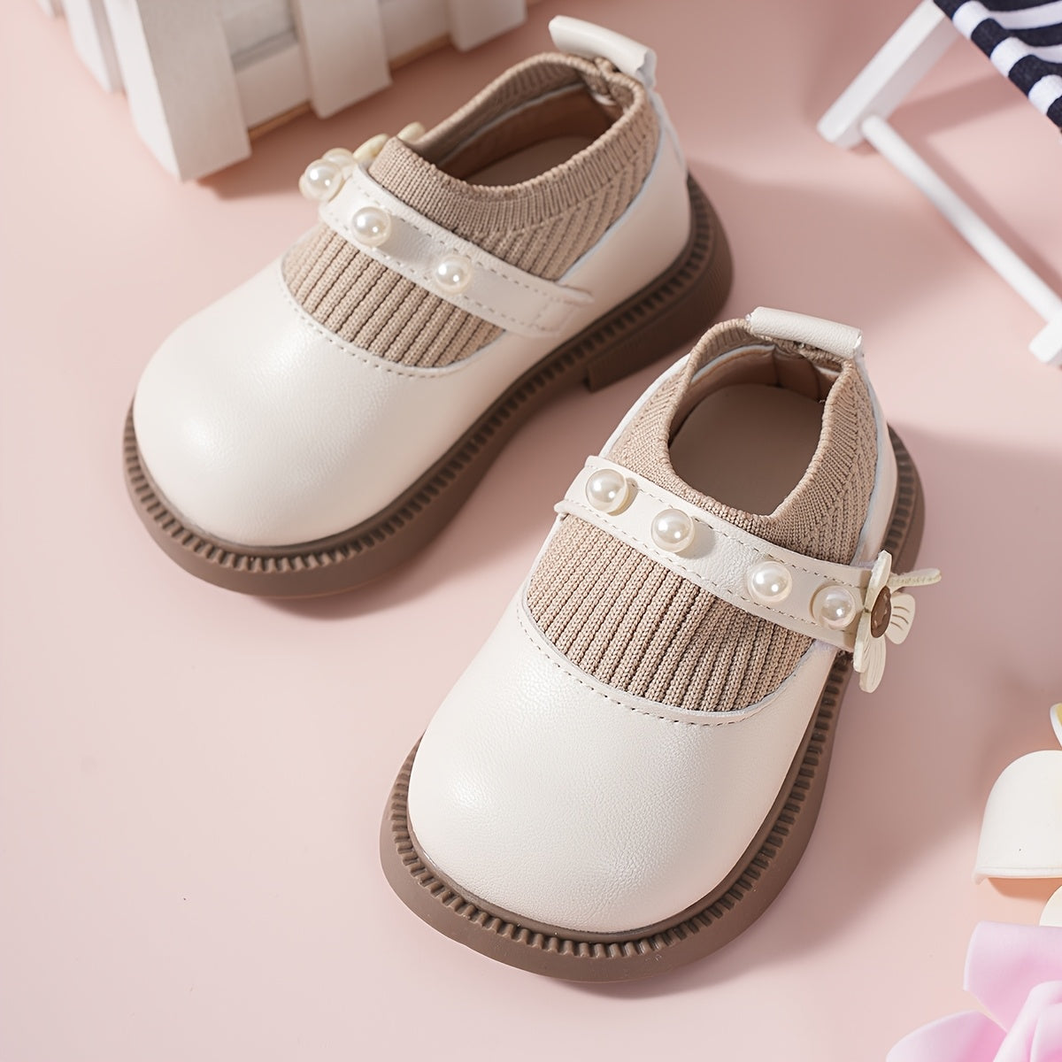 Pair of stylish baby shoes with flower bead accents, perfect for all seasons, including princess flats.