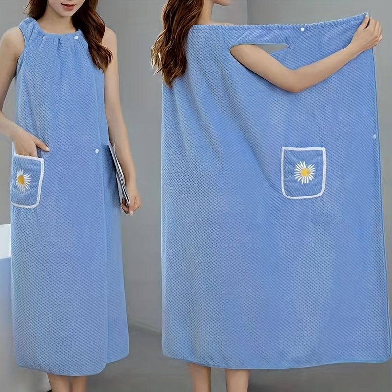 Extra-long light blue coral fleece bath towel with daisy pocket. Highly absorbent, machine washable, soft, and durable. Perfect for bathroom or robe wear.