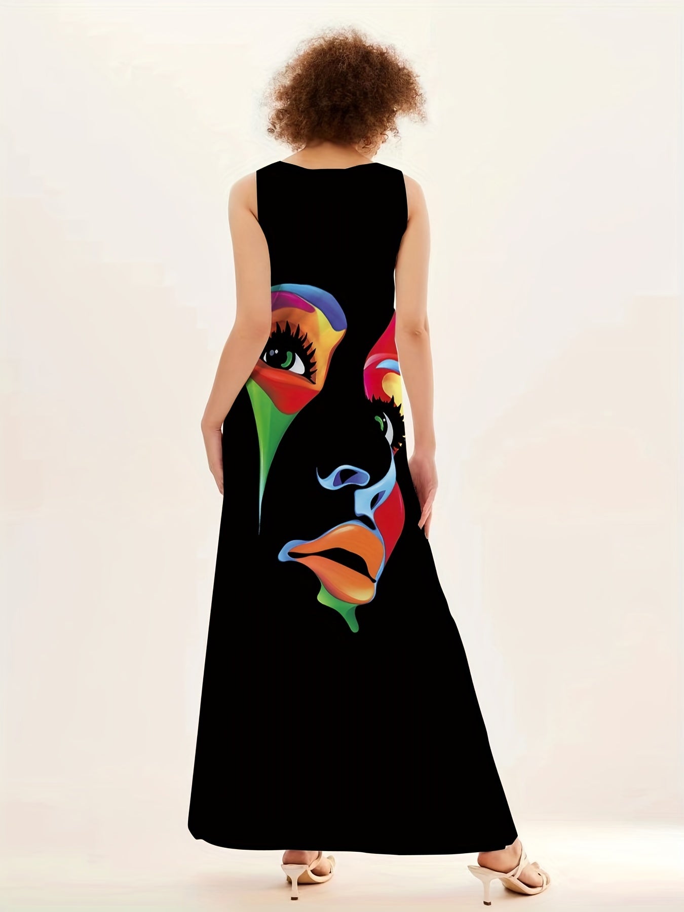 Abstract face print maxi dress with notched neck, sleeveless design perfect for summer and spring wear in women's clothing.