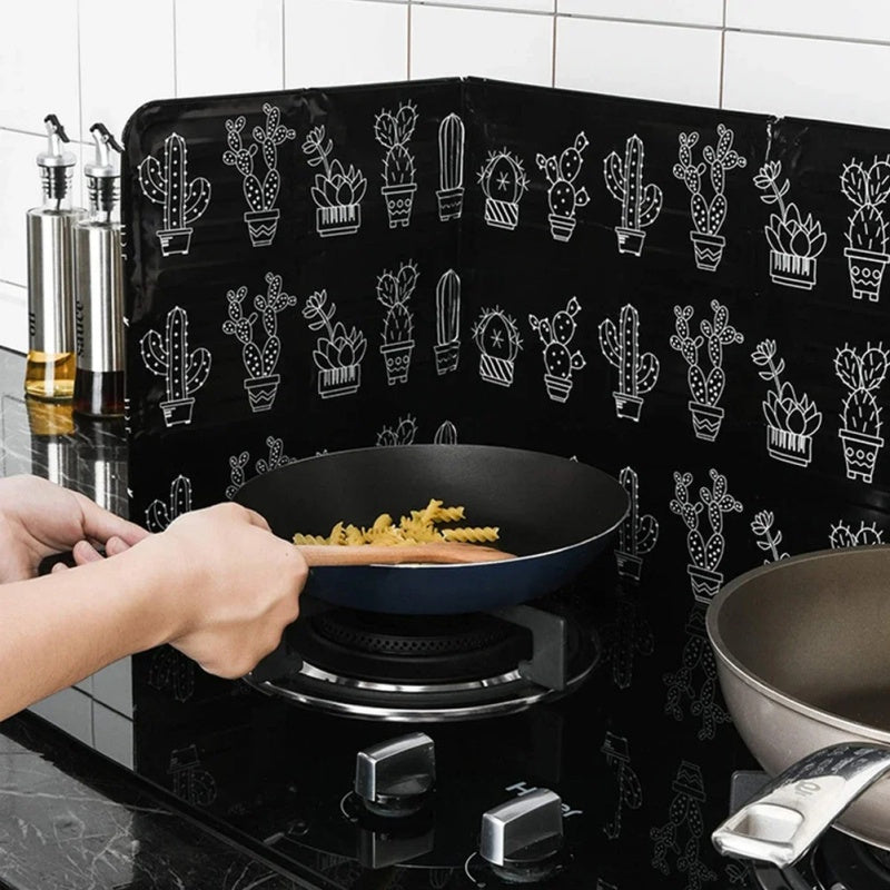 Kitchen stove baffle made of foldable aluminum foil featuring a tropical leaf pattern. This splash guard and cooking safety screen is perfect for deep frying and adding a touch of style to your kitchen decor. Use it as stove top protectors for added