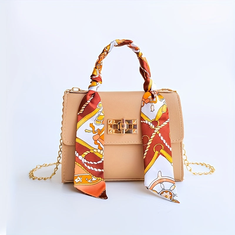 Elegant PU leather crossbody bag with geometric print and scarf accent. Lightweight and versatile, available in various colors.