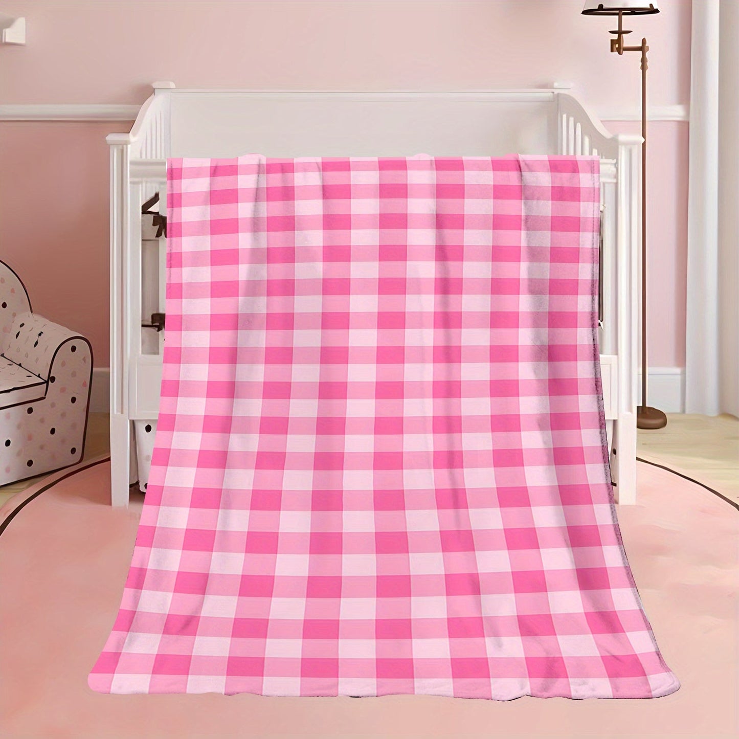 Soft and cozy polyester knit pink gingham flannel throw blanket. Ideal for adding a touch of contemporary style to your bedroom, sofa, or living room decor. Perfect for all-season use and makes an ideal gift for girls, daughters, and sisters. Features a