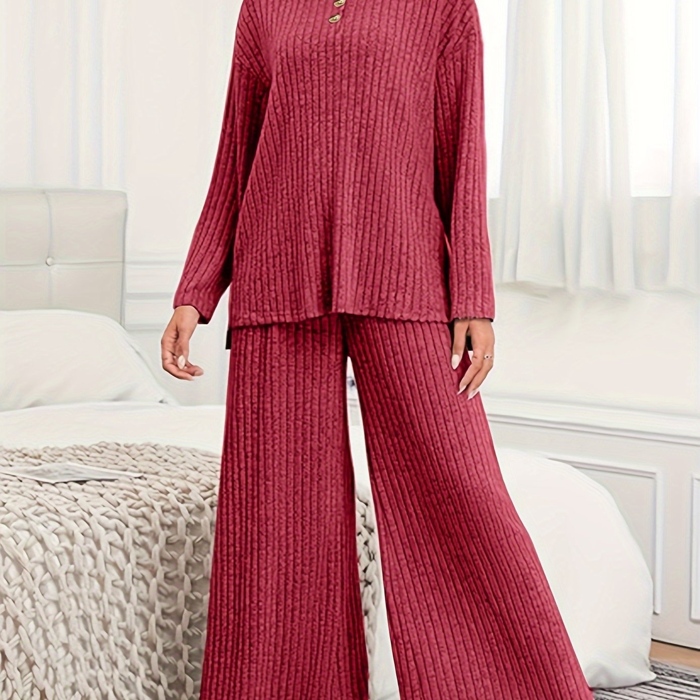 Women's casual suit with ribbed knit top and matching hooded wide-leg pants.