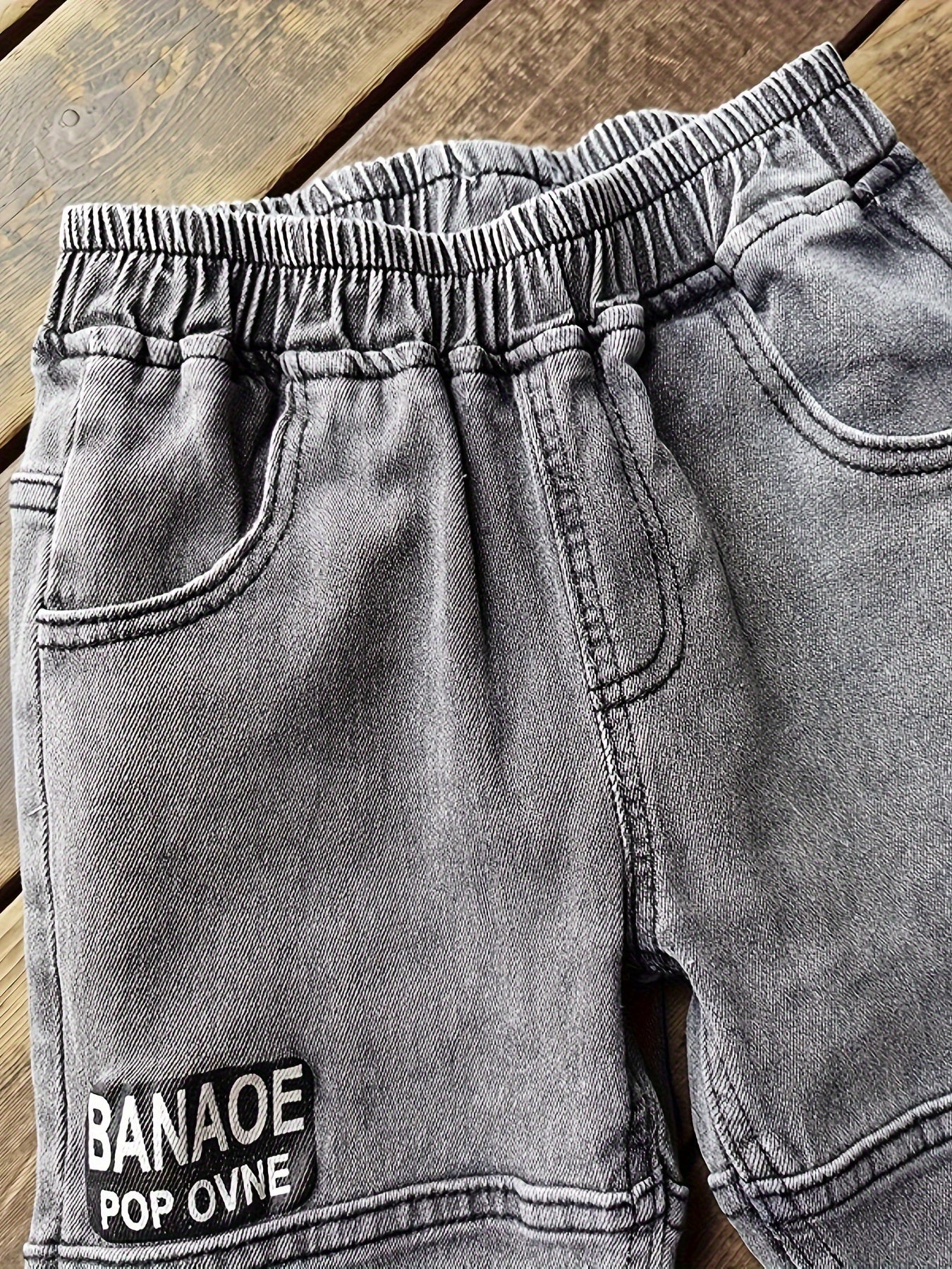 Boys' versatile denim pants with patch detailing for all seasons.