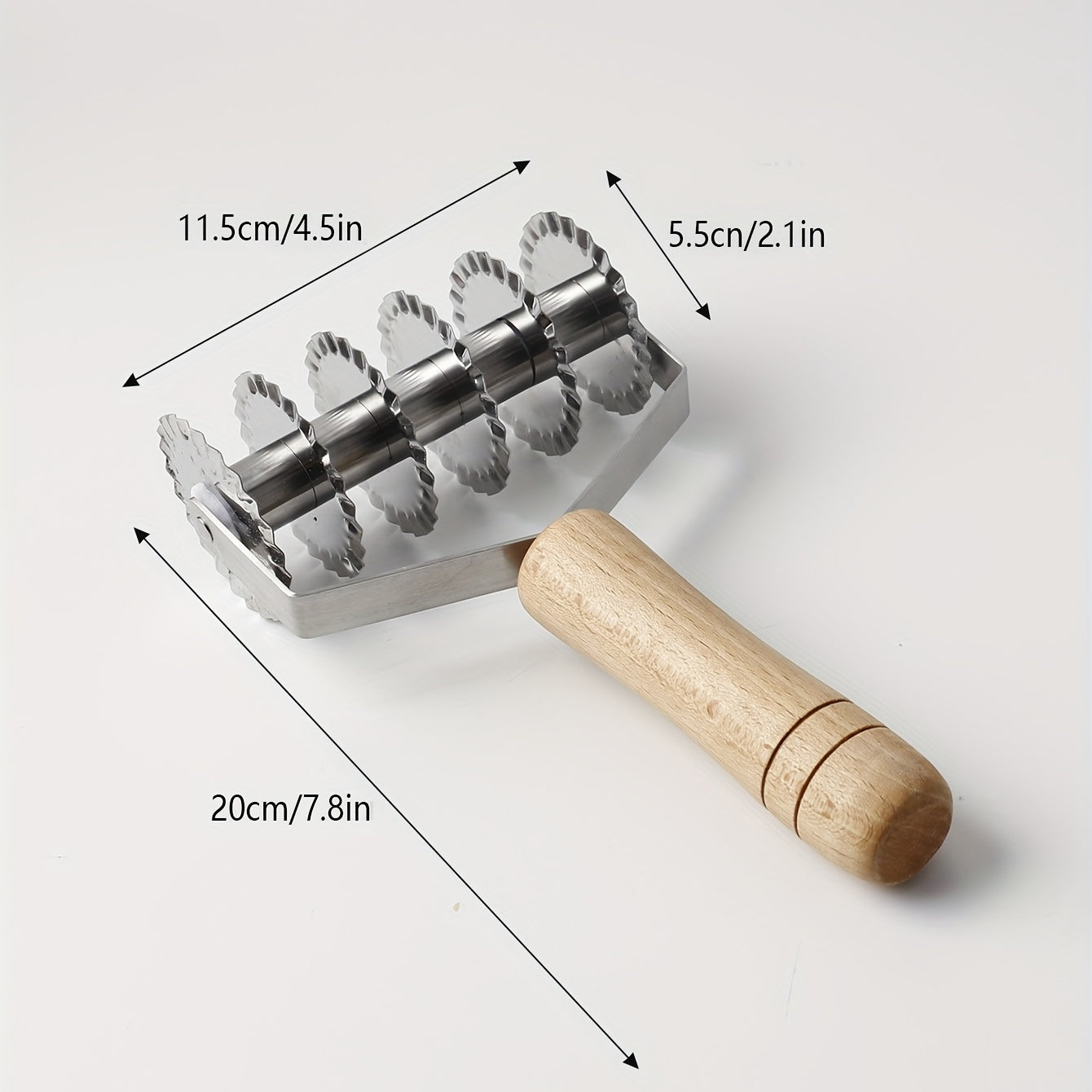 Six-wheel stainless steel cookie and noodle cutter with a wavy wood handle - Perfect for cutting cookies and noodles in the kitchen.