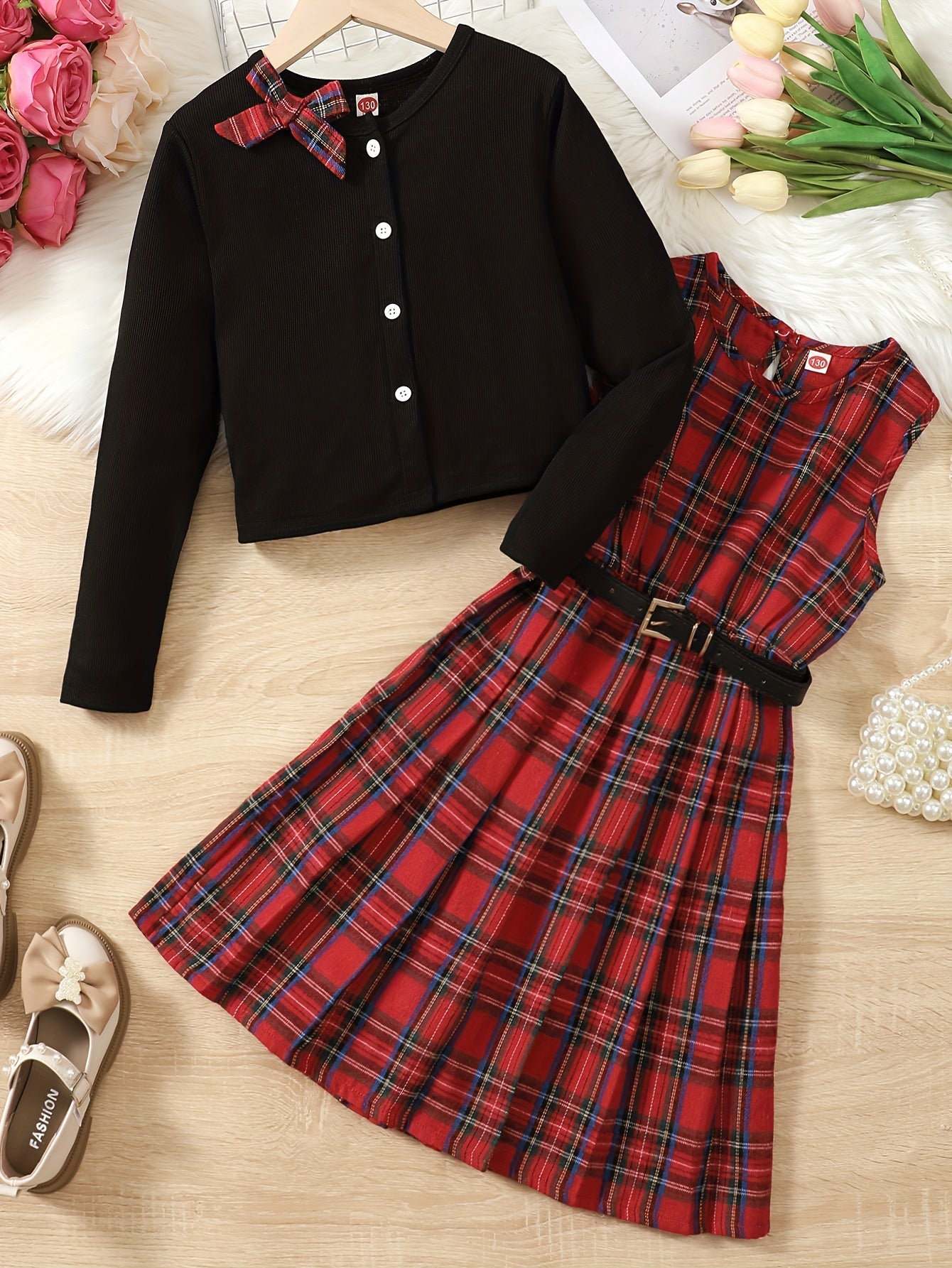 Tween girls' two-piece dress set includes a bow round neck ribbed button jacket cardigan and a sleeveless round neck plaid pleated dress with belt. Perfect for Valentine's Day or New Year