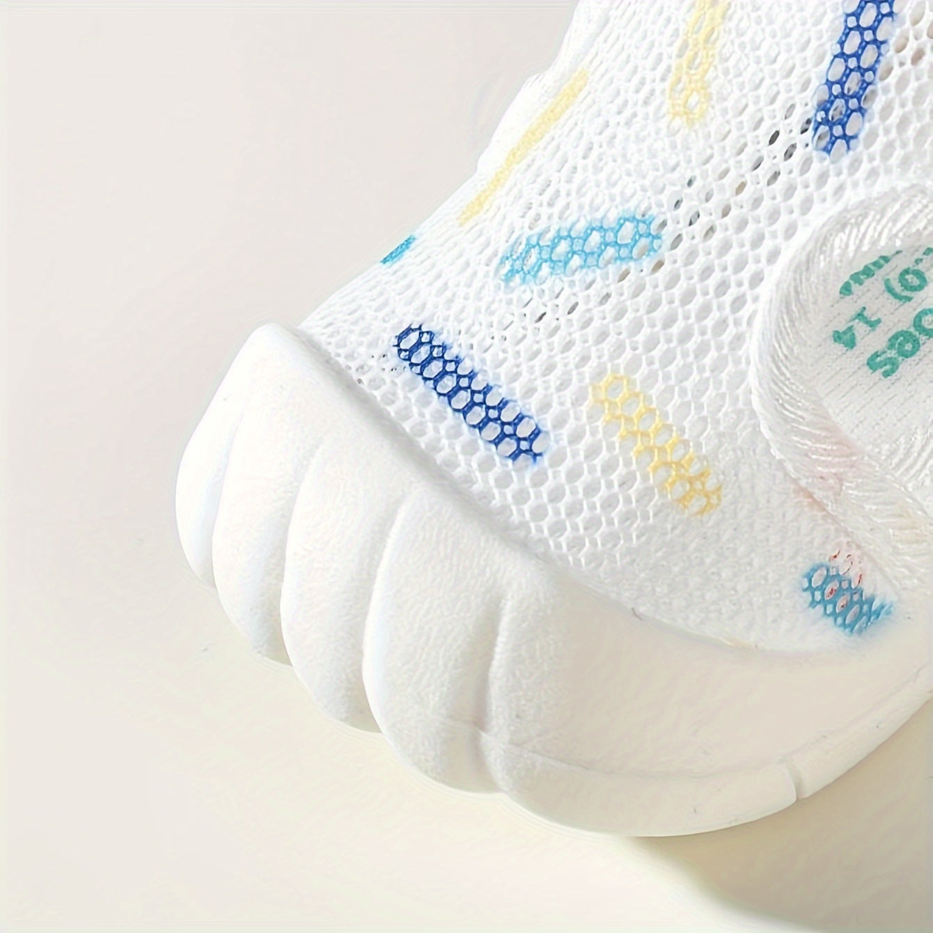 Lightweight, non-slip mesh sandals for infants and toddlers, ideal for summer.