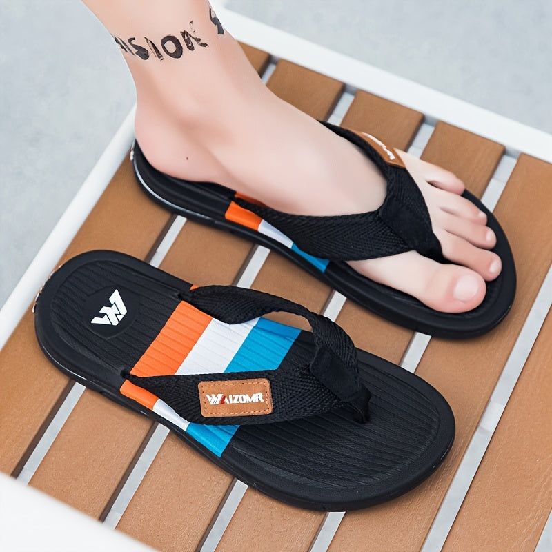 Stylish men's color block flip flops with non-slip rubber sole for indoor activities.