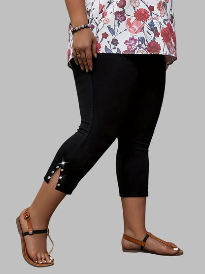 Polyester capri pants with rhinestone detail, slit hem, and high waist for outdoor activities.