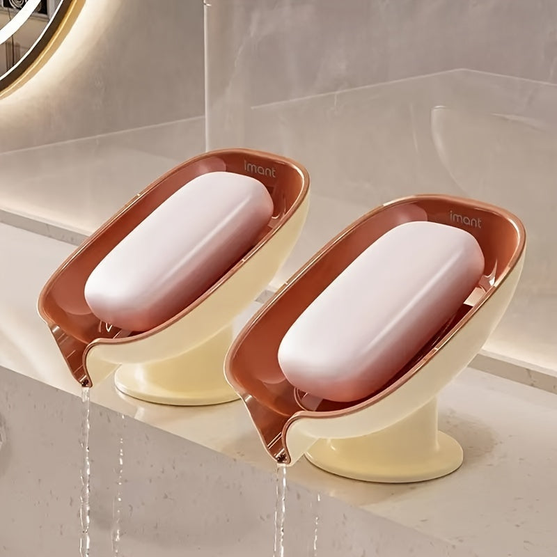 Durable plastic oval soap dish with an elegant, self-draining design for bathroom use.