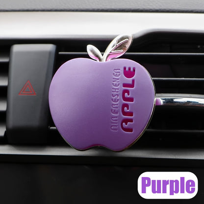 Apple-shaped car air freshener with aromatherapy perfume diffuser and vent clip fragrance dispenser. Includes balm/tablet/incense stick for portable auto scent enhancement.