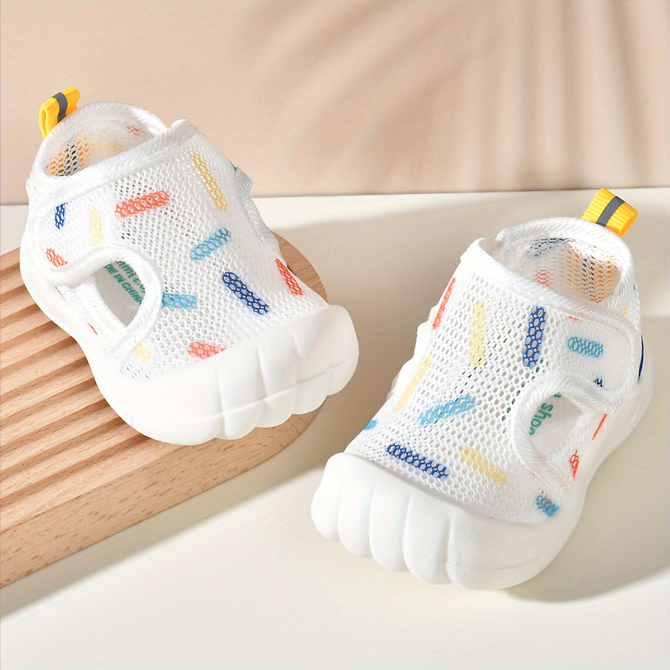 Lightweight, non-slip mesh sandals for infants and toddlers, ideal for summer.