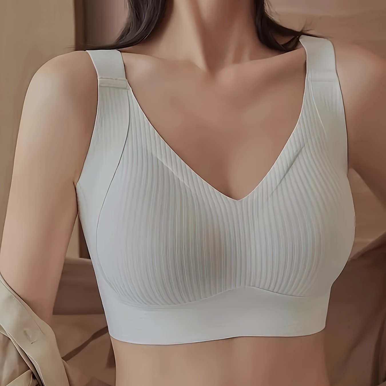 Elegant solid color bralette with soft support and medium support, made of comfortable knit fabric with wide straps.