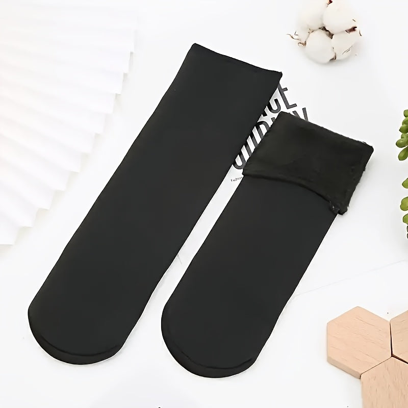 5 pairs of cozy mid-calf boot socks made of soft, breathable, elastic polyester for cold weather comfort.