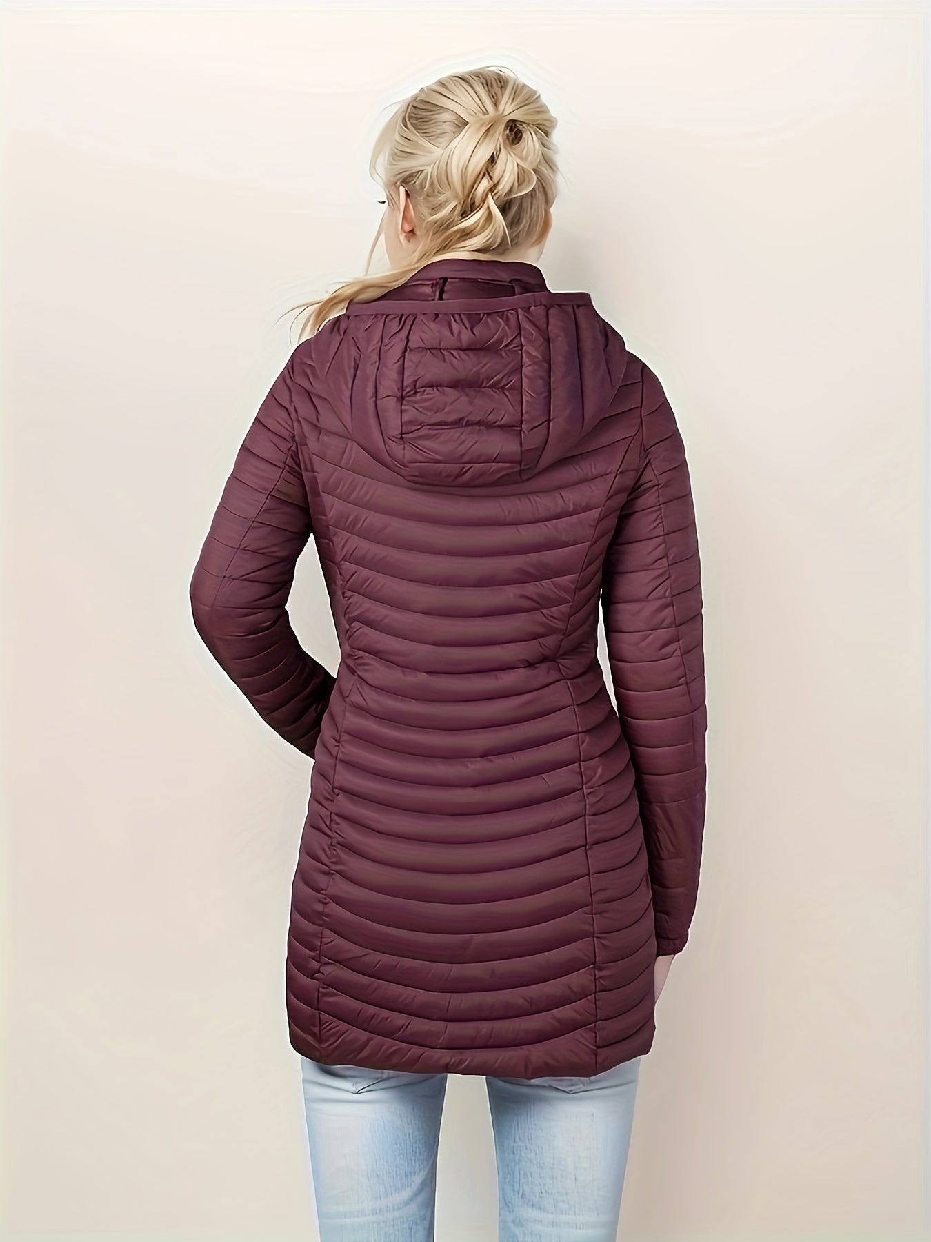 Women's lightweight puffer coat with detachable hood, perfect for winter comfort.