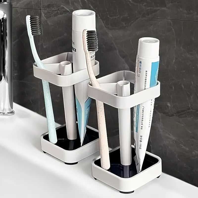 Modernize your bathroom with this sleek white toothbrush holder and cup lid combo. Perfect for organizing electric toothbrushes, toothpaste, dental floss, and razors with its 3 slots. Made from durable plastic, this organizer does not require power and