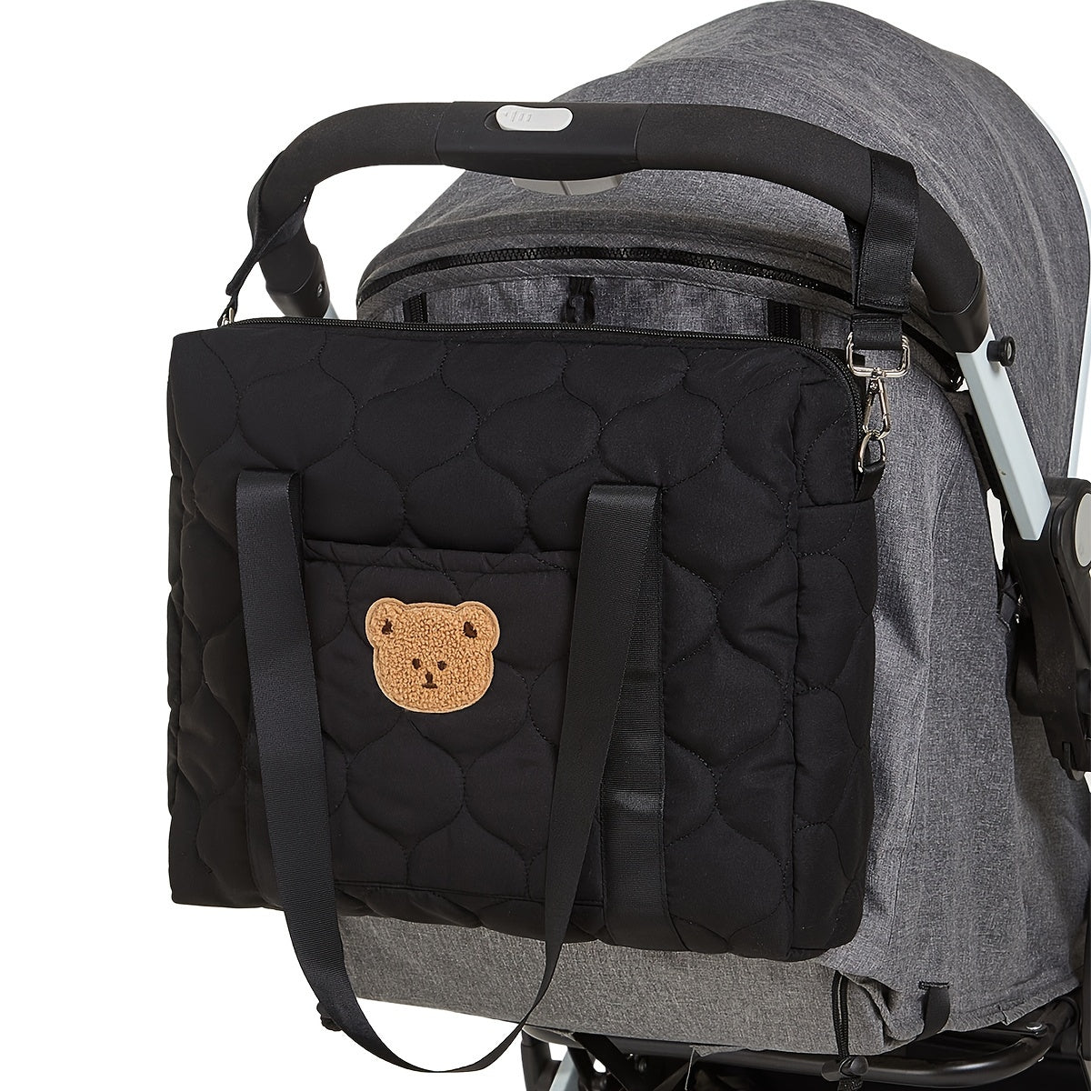 Large black parent bag with ample storage space, perfect for taking on the go. Features a shoulder strap for easy carrying.