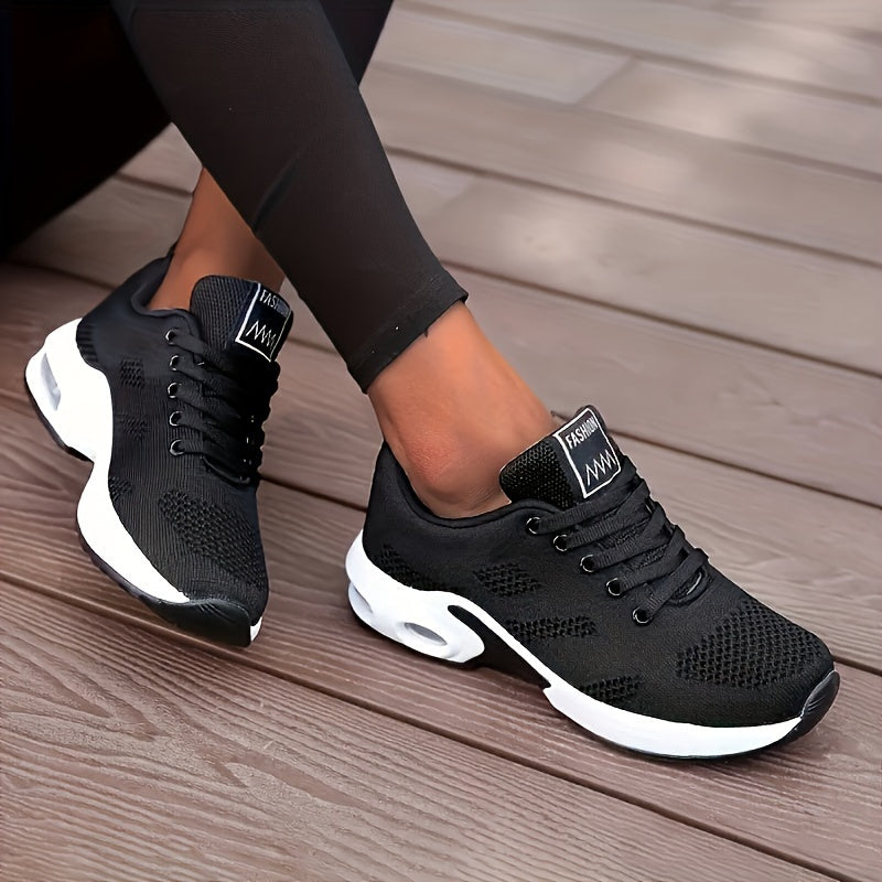 White running shoes for women with breathable knit material, air cushion sole, and shock-absorbing platform design.