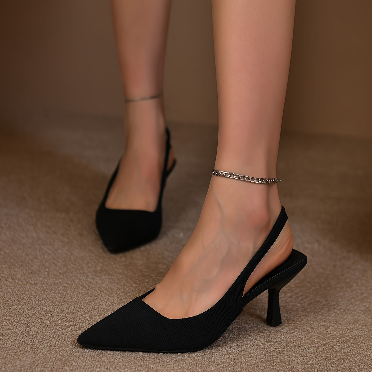 Solid color stiletto heels with point toe and elegant ankle strap.