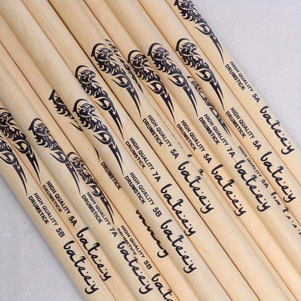 Lightweight drumsticks with totem design, selectable sizes 5A, 7A, and 5B. Made of high-quality natural wood with a precision grip, uncharged pair.