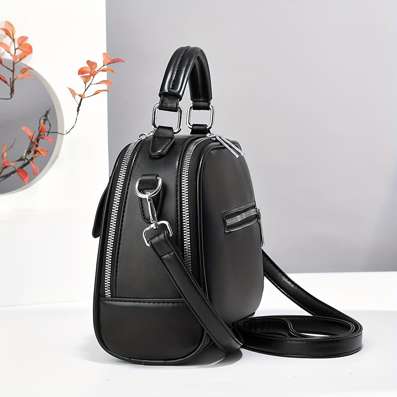 Women's casual shoulder bag made of PU material with zipper closure, polyester lining, oil-coated finish. Simple and versatile design.