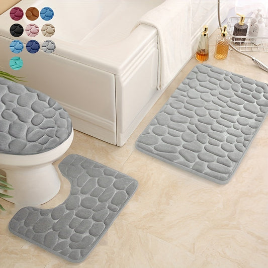 Set of 3 Memory Foam Bathroom Rugs featuring Cobblestone Embossed design. These ultra soft rugs are non-slip and absorbent, including a U-shaped contour rug. Ideal for use in bathrooms or showers, this set is a must-have for your bathroom supplies.