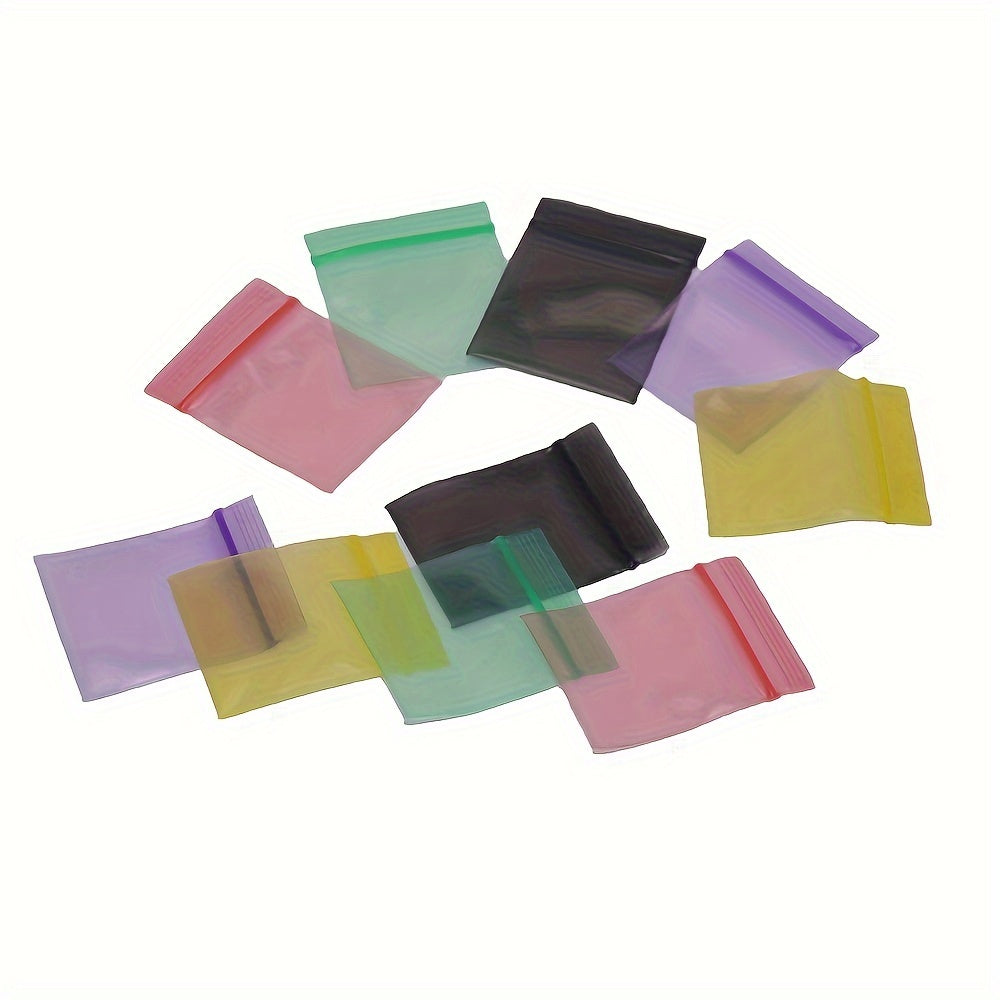 100 pieces of storage bags, featuring double-sided 10 silk thickened self-sealing bags. These reusable small packaging bags measure at 4*4.5cm/1.57*1.77inch and are perfect for storing keys, buttons, pills, and small items. Ideal for kitchen organizers