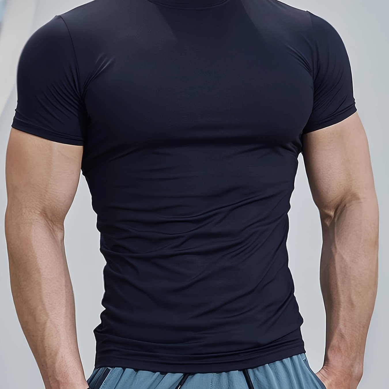 Men's athletic high neck t-shirt with quick dry, compression, and stretch fabric, ideal for training and running.