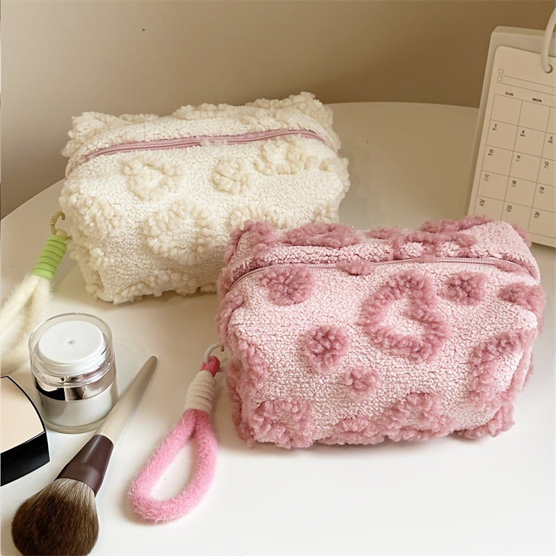 Heart-shaped hand carry bag for women, ideal for on-the-go skin care and cosmetic storage.