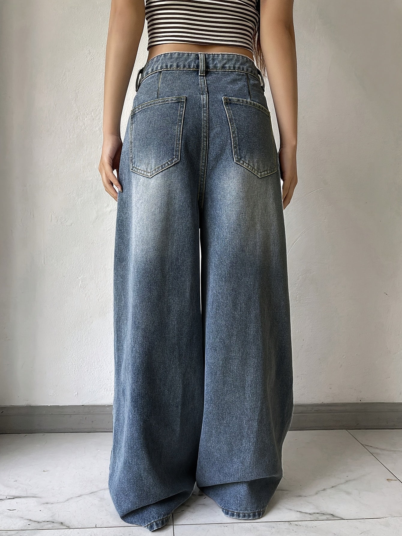 Water washed blue extra long wide leg jeans for women, perfect for casual autumn wear.